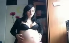 Cute pregnant showing off her belly on webcam
