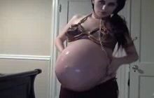 Pregnant lady playing with her belly