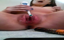 Preggo slut masturbates with a toothbrush
